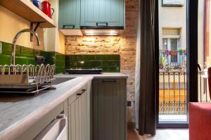 Küche/Küchenzeile in der Unterkunft Priorat Aparthotel