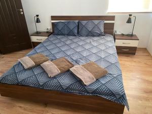 a bedroom with a large bed with two night stands at Holiday Villapark - Seaview Albena - Rogachevo - Bulgaria in Rogachevo +154 photos