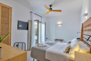 Postel nebo postele na pokoji v ubytování Calma Boutique Hotel