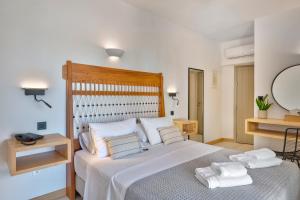 Postel nebo postele na pokoji v ubytování Calma Boutique Hotel