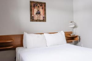 Postel nebo postele na pokoji v ubytování Paradise Motel