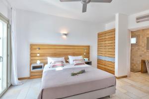 Postel nebo postele na pokoji v ubytování Calma Boutique Hotel