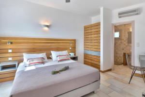 Postel nebo postele na pokoji v ubytování Calma Boutique Hotel