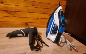 a iron is sitting on a table with keys at The Green King in Borovets
