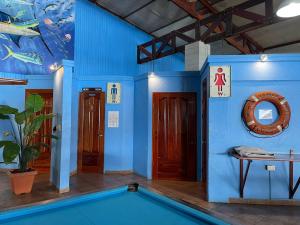 a room with a swimming pool in a house at Fish Hook Marina Hotel in Golfito