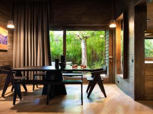 a dining room with a table and a window at Hardwood House in Daylesford