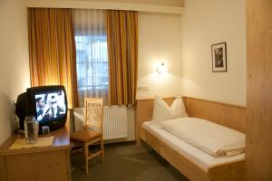 Łóżko lub łóżka w pokoju w obiekcie Hotel Garni Forelle