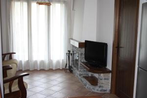 Televízia a/alebo spoločenská miestnosť v ubytovaní Nadal Apartaments