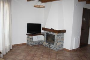 Televízia a/alebo spoločenská miestnosť v ubytovaní Nadal Apartaments