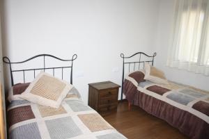 Posteľ alebo postele v izbe v ubytovaní Nadal Apartaments