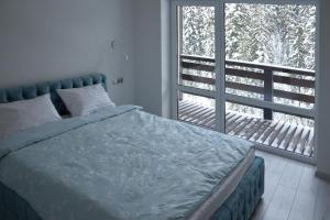 Кровать или кровати в номере Котедж у горах "Місце Сили"