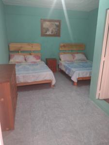 Postel nebo postele na pokoji v ubytování Hostal Eclipse Oaxaca