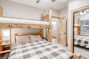 a bedroom with two bunk beds and a mirror at Susquehana Luxury in South Lake Tahoe