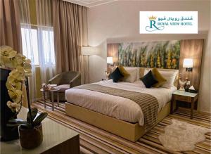 Postel nebo postele na pokoji v ubytování Royal View Hotel