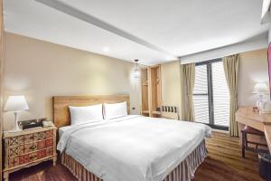 Katil atau katil-katil dalam bilik di Lan Kwai Fong Garden Hotel