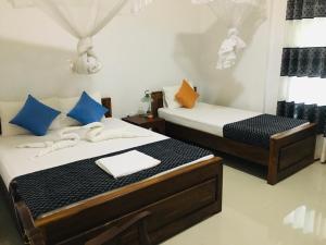 Postel nebo postele na pokoji v ubytování Restwell Homestay