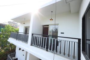 a balcony of a house with black railing at The House Of Brothers in Arambol