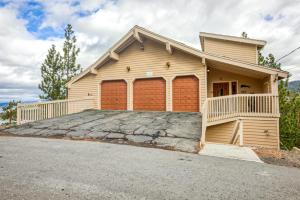 a house with a large garage in front of it at Lookout Lodge in Zephyr Cove