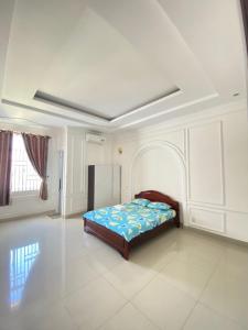 Ένα ή περισσότερα κρεβάτια σε δωμάτιο στο Lavie House 69-7A Phan Chu Trinh