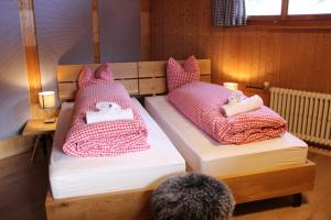 Säng eller sängar i ett rum på Schifer Berghaus