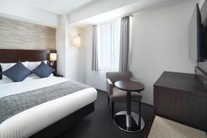 Postel nebo postele na pokoji v ubytování ART HOTEL Nippori Lungwood