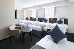 Postel nebo postele na pokoji v ubytování ART HOTEL Nippori Lungwood