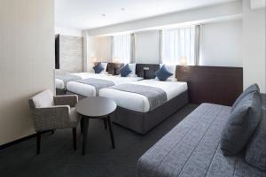 Postel nebo postele na pokoji v ubytování ART HOTEL Nippori Lungwood