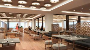 a rendering of a restaurant with tables and chairs at Ammoa Luxury Hotel & Spa Resort in Nikiti