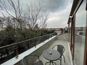 a patio with a table and chairs on a balcony at BayMari Suites Plus Florya in Istanbul