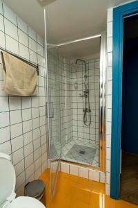 a bathroom with a shower and a toilet at City Center Ground Loft - Ioannina in Ioannina +31 photos