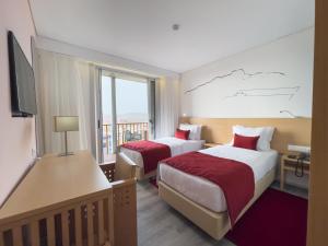 Postel nebo postele na pokoji v ubytování Hotel Happy Day