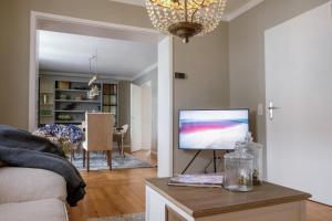 TV a/nebo společenská místnost v ubytování Saarlouis Innenstadt im Grünen