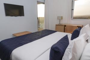 Postel nebo postele na pokoji v ubytování Hotel Happy Day