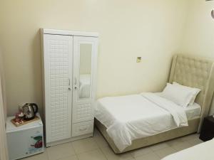 Postel nebo postele na pokoji v ubytování شاليهات ليماس ميناء العرب + 37 fotografií