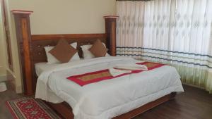 Vuode tai vuoteita majoituspaikassa London House Resort