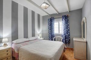 A bed or beds in a room at Casa Marrero Abajo