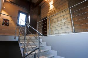 a staircase in a room with a brick wall at La Piana Hotel in Tito