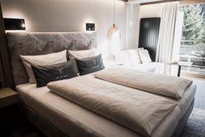 Posteľ alebo postele v izbe v ubytovaní Verwöhn-Wellnesshotel Walserhof