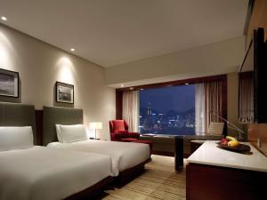 Postelja oz. postelje v sobi nastanitve Hyatt Regency Hong Kong Tsim Sha Tsui