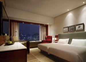 Postelja oz. postelje v sobi nastanitve Hyatt Regency Hong Kong Tsim Sha Tsui