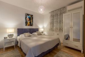 Postel nebo postele na pokoji v ubytování Split-Villas Dalmatica for 12