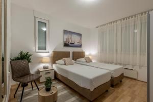 Postel nebo postele na pokoji v ubytování Split-Villas Dalmatica for 12