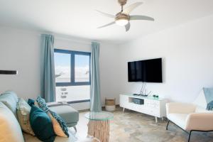 Telewizja i/lub zestaw kina domowego w obiekcie Planta alta - Villa Arosa