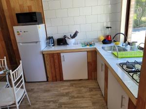 A cozinha ou cozinha compacta de Departamentos Del Lago