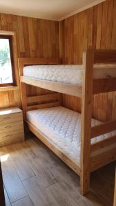 Una cama o camas en una habitación de Departamentos Del Lago