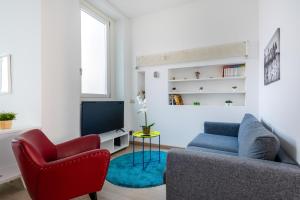 TV i/ili multimedijalni sistem u objektu Loft Moderno in Dateo