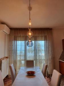 a dining room table with a plate of food on it at Pini sul Mare in Roseto degli Abruzzi