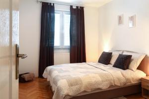 Postel nebo postele na pokoji v ubytování Apartment Igor