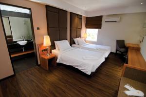 Postel nebo postele na pokoji v ubytování C'haya Hotel