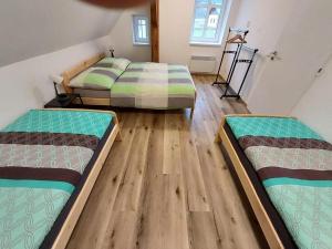 Postel nebo postele na pokoji v ubytování Apartmány Rudník Bolkov